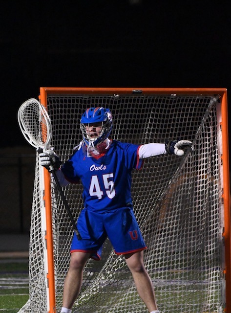 Joel Hobson playing lacrosse goalie for Memphis University School