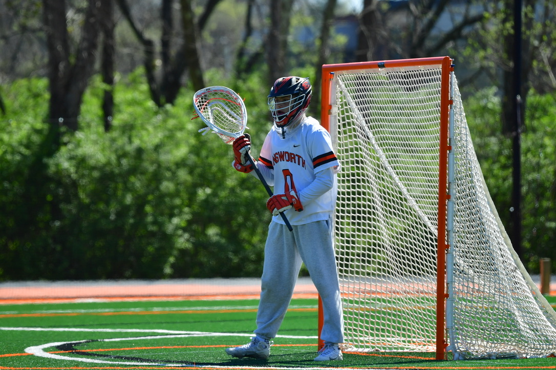 Jonathan Drobny playing lacrosse goalie for Ensworth